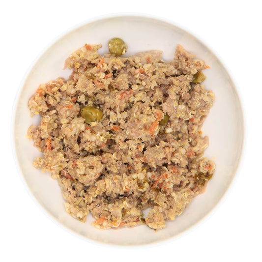 An image of The Nojo's Dog lean beef recipe in a bowl. You can see the vibrant color of the cooked carrots, peas, quinoa, and beef.